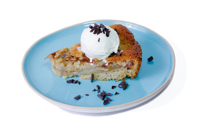 Homemade pear cake with ice cream covered by chocolate chips