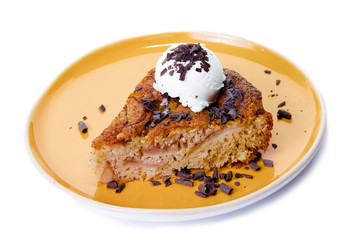 Homemade pear cake with ice cream covered by chocolate chips