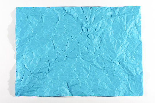 Wrinkled blue A4 sheet of paper isolated
