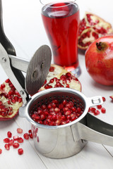 pomegranate fruits, pomegranate juice and juice press