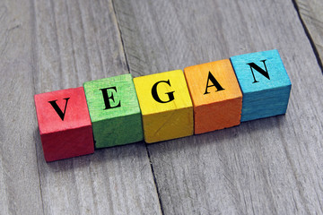 concept of vegan word on wooden colorful cubes