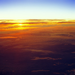 Fototapeta na wymiar Sunset over a clouds.