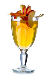 Glass of mulled wine with spices isolated on white