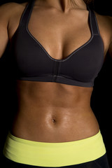 Fototapeta na wymiar woman black bra body close stomach shiny