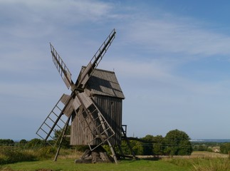 Fototapeta na wymiar A historic wooden wind mill at the countryside of Oeland