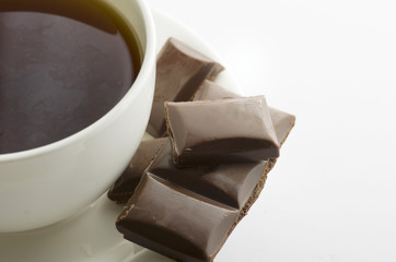 Cup of hot tea with dark chocolate