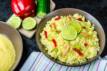 Couscous with grilled chicken meat and vegetables