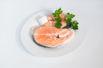 Fresh trout on the white plate, served with parsley