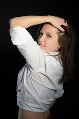 Beautiful brunette woman touching her hair