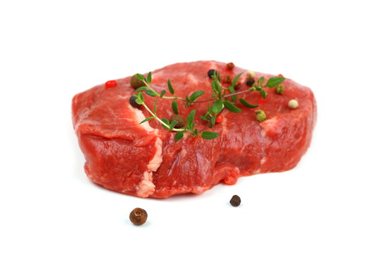 Juicy, raw beef steak with spices