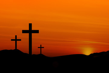 Crosses on a Hill Against an Orange Sunset