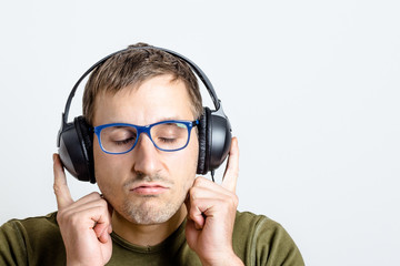 Young man listens to music