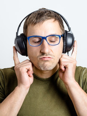 Young man listens to music