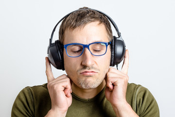 Young man listens to music
