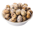 Quail eggs in white bowl over white background