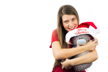 Happy beautiful girl holding Christmas present