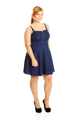 Plus size woman posing in skirt