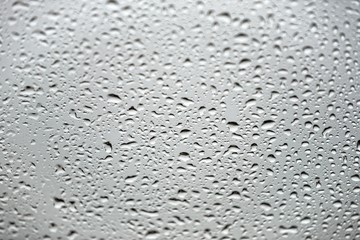 Natural water drops on glass