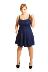 Overweight woman with her fists up