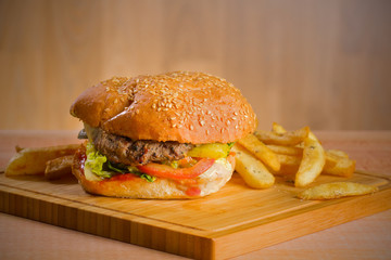 Tasty burger with melted cheese and thick succulent ground beef