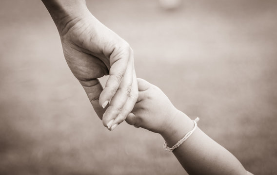 hands of mother and child