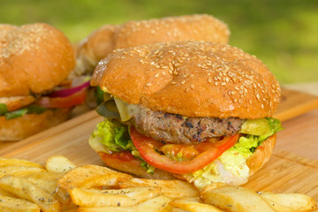 Tasty burger with melted cheese and thick succulent ground beef