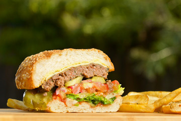 Cutted burger with melted cheese and thick succulent ground beef