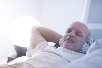 self-confident man relaxing on a sofa