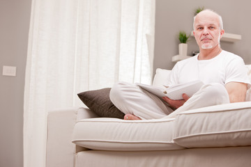 portrait of smiling man on a couch