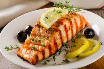  Salmon with lemon, olives and  herbs