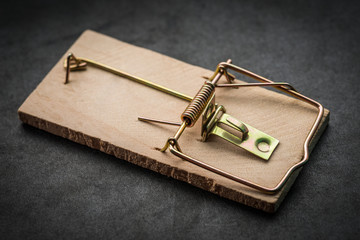 Mousetrap on dark background. Selective focus.