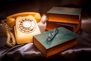 Retro phone and old book.