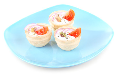 Tartlets with greens and vegetables with sauce