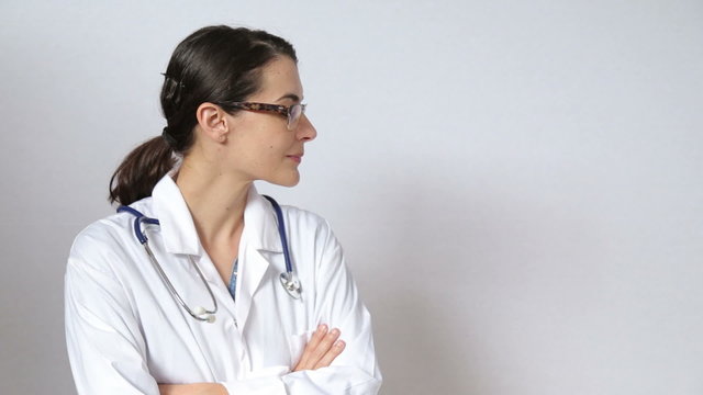 attractive female doctor looking straight at the camera