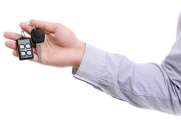 Businessman holding car key isolated on white