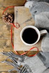 Cup of tea with book on table close-up