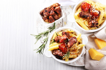 Tasty pasta with meat in ceramic pot
