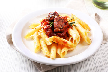 Tasty pasta with meat on table