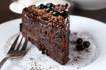 Yummy chocolate cake served on table, close-up