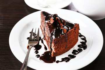 Yummy chocolate cake served on table, close-up