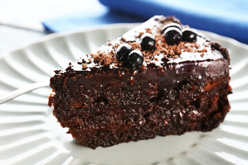 Yummy chocolate cake served on table, close-up