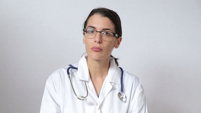 attractive female doctor looking straight at the camera