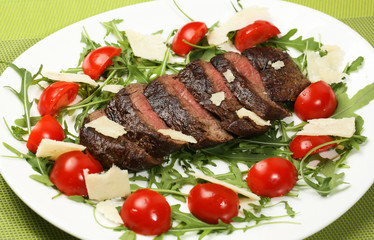 Grilled meat with tomatoes and cheese