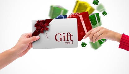 Composite image of hands holding card