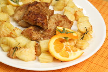 Delicious potatoes and meat with lemon