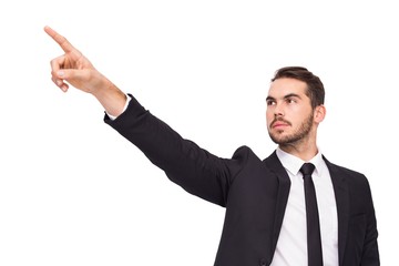 Thoughtful businessman pointing his finger