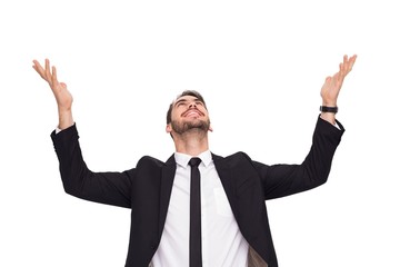 Businessman cheering with hands raised