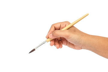 Hand holding paintbrush isolated on white background.
