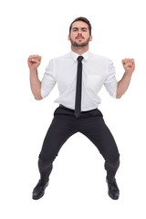 Focused businessman lifting up something heavy