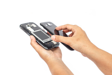 Hand holding smartphone and open backside cover isolated on whit